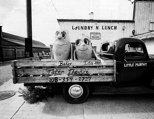 black & white photo of large cement potatoes in the back of an old pickup by David Kennerly